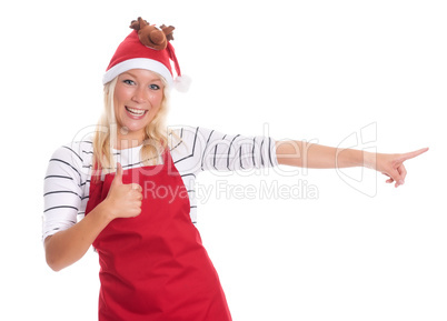 Weihnachtsfrau mit Schürze zeigt Daumen hoch
