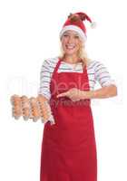 Weihnachtsfrau hält eine Palette mit Eiern