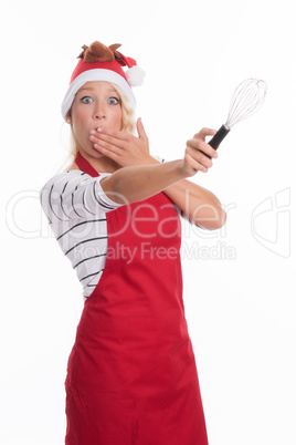 Weihnachtsfrau mit Schneebesen ist erschrocken