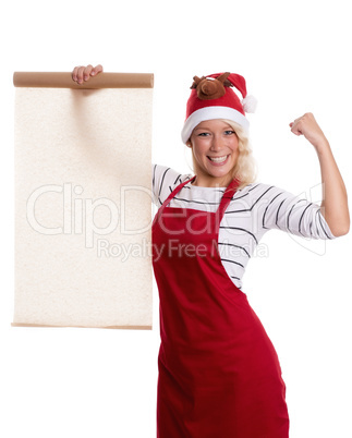 Frau mit Weihnachtsmütze hält ein Backpapier als Werbefläche