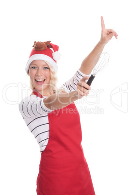 Weihnachtsfrau mit Schneebesen zeigt auf etwas