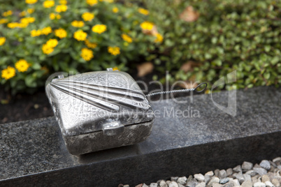 Holy water shell at the grave