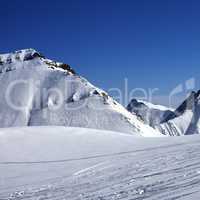 Ski slope at nice sunny winter day