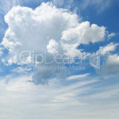 The white cumulus clouds against the blue sky