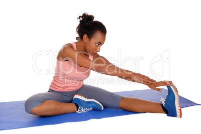 Beautiful african american woman stretching.