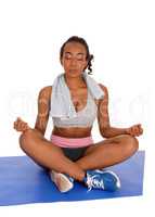 African american woman sitting yoga position.