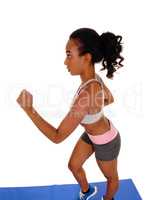 Young african american woman running.