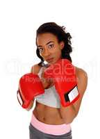 African american woman wearing boxing gloves.