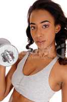 Young lady exercising with dumbbell's.