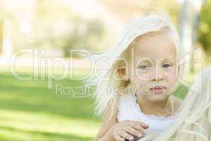 Meloncholy Portrait of Cute Little Girl Outside