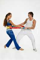 Young Woman And Man With Training Device