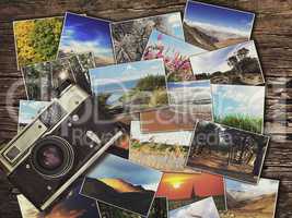 old vintage camera and photos on a wooden background