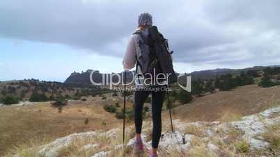 JIB CRANE: Young woman highland day hiking