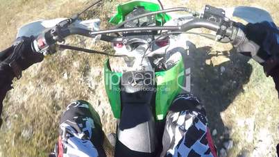 Point of View: Enduro racer riding dirt bike off-road