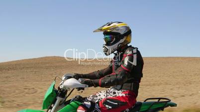 Motocross racer riding his offroad motorbike