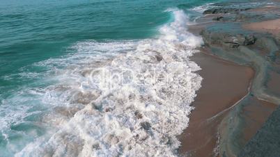 Slow motion Ocean Waves Breaking on Shore, closeup