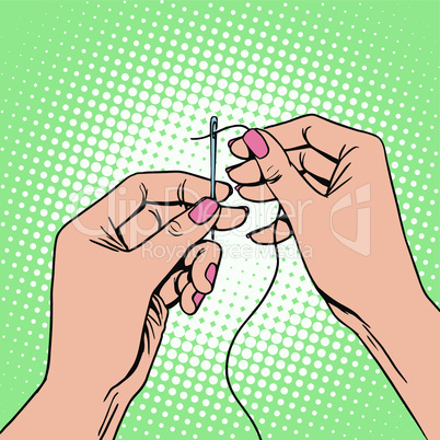 Needlework seamstress threads the needle