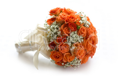 Wedding bouquet made of orange roses on white