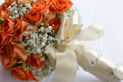 Wedding bouquet made of orange roses on white
