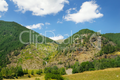 scenic mountains, meadows and blue sky