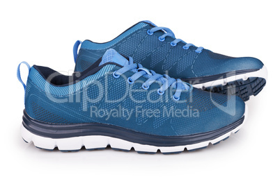 Blue sneakers with shadow isolated on white