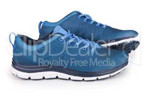 Blue sneakers with shadow isolated on white