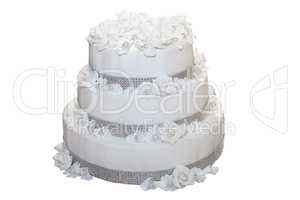 Three tiered wedding cake isolated on white