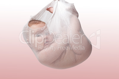 Adorable baby girl in a bundle on pink background