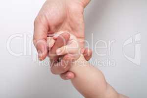 Mommy holding baby's hand