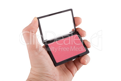 Female hand holding a red blush, isolated on white