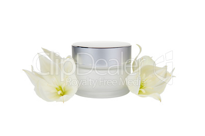 Jar with the cosmetic cream and flowers