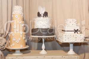 Three elegant wedding cakes