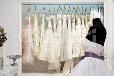 Wedding dresses on hangers in the showroom