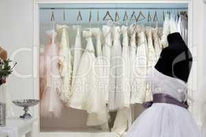 Wedding dresses on hangers in the showroom