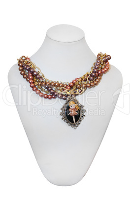 Colorful pearl necklace on a mannequin, isolated on white