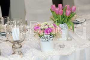 Table decorated with candles and flowers