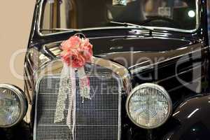 Vintage car with wedding bouquet