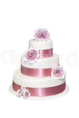 Wedding cake with roses isolated on white