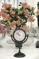 Antique clock and roses