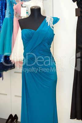 Beautiful turquoise gown on mannequin in a bridal shop