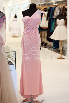 Beautiful pink gown on mannequin in a bridal shop