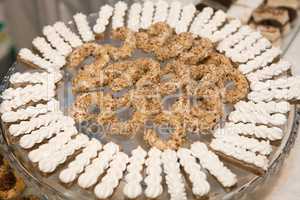 Meringue snacks and nut cookies on a plate