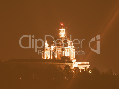 Retro looking Basilica di Superga at night in Turin