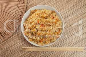 bowl of tasty cooked rice with chopsticks