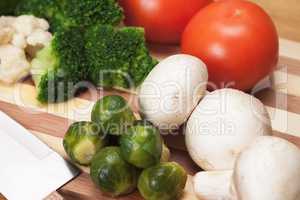 fresh food ingredients and knife on the breadboard