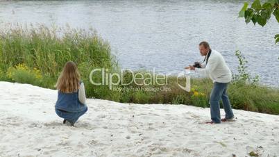 a couple photographed themselves on shore