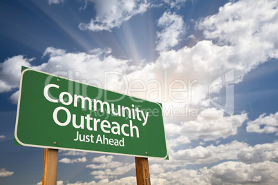 Community Outreach Green Road Sign Over Clouds