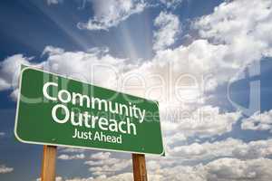 Community Outreach Green Road Sign Over Clouds