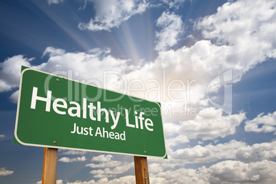 Healthy Life Green Road Sign Over Clouds