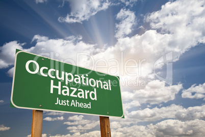 Occupational Hazard Green Road Sign Over Clouds